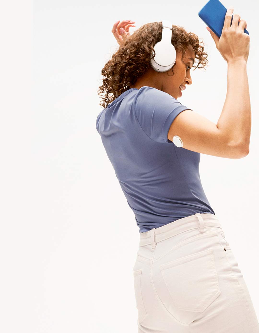 person dancing with sensor on arm