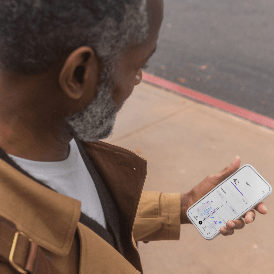 Man looking at Lingo app. 