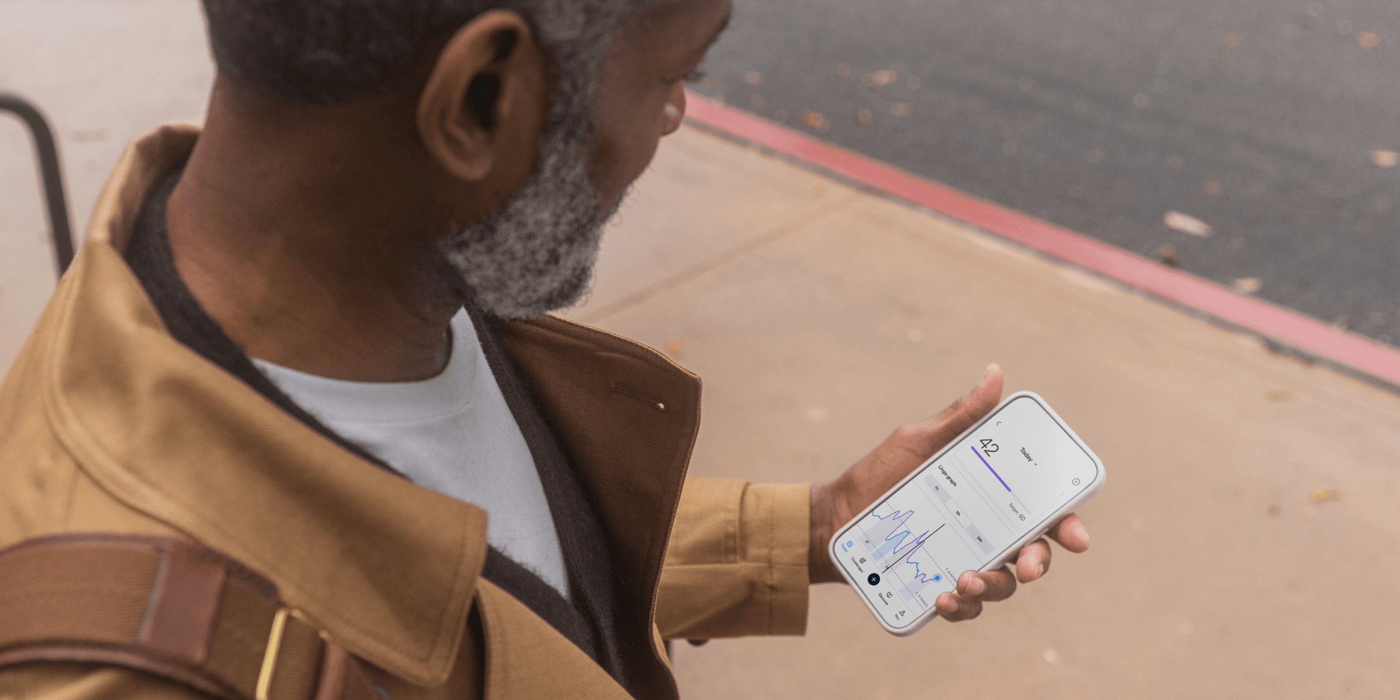 Man looking at Lingo app. 