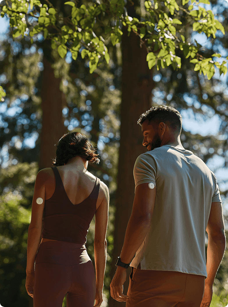 Couple walking in trees 