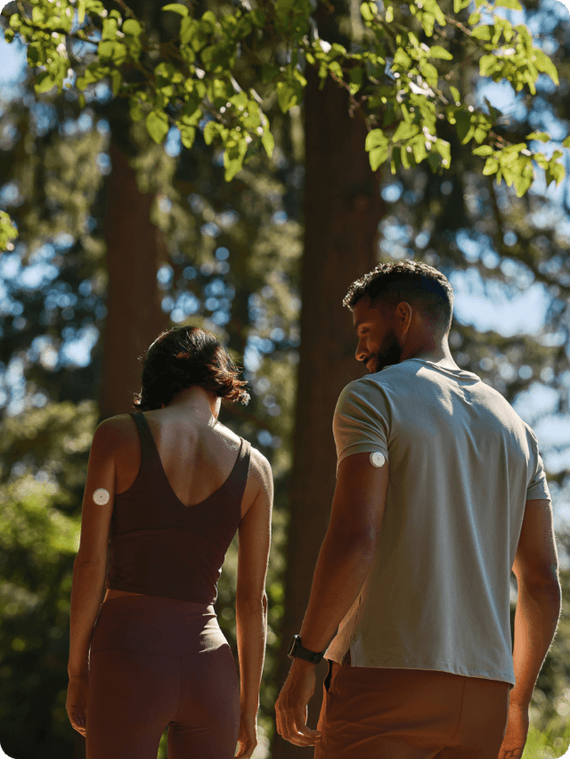 Couple walking in trees 