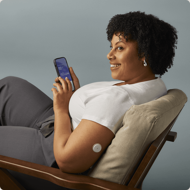 A man sitting in a chair wearing a lingo biosensor