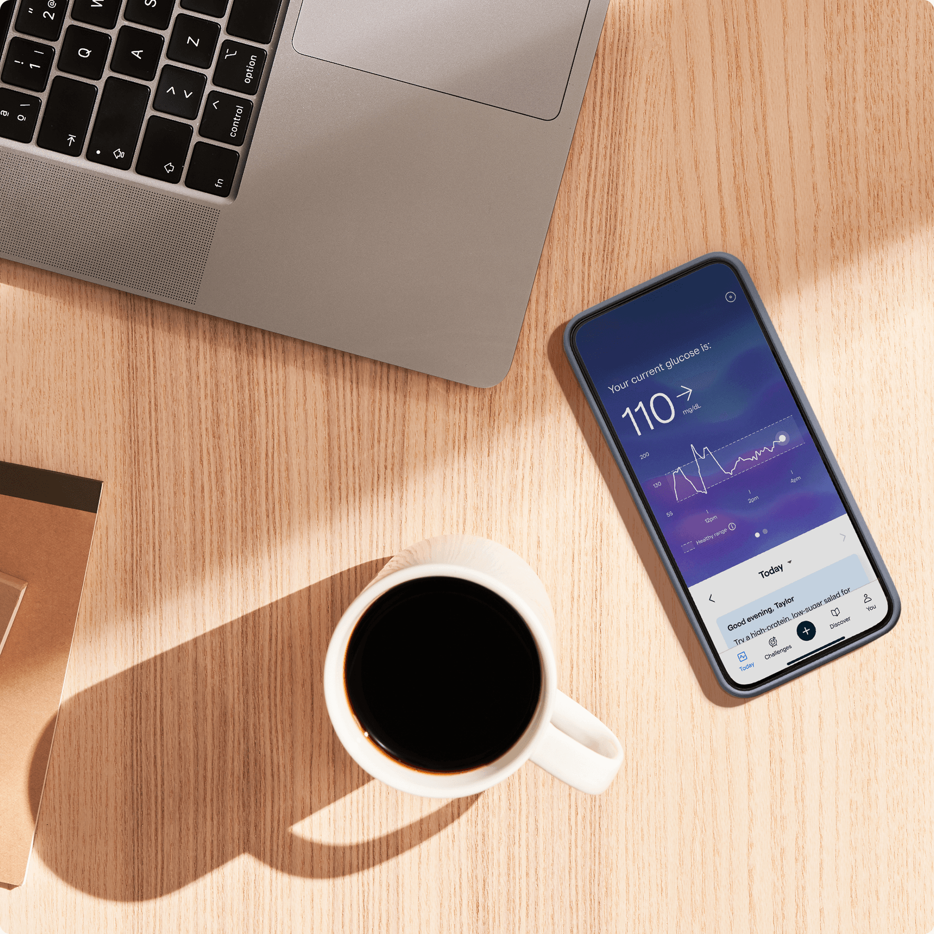 Image of a phone with the Lingo App open on a desk