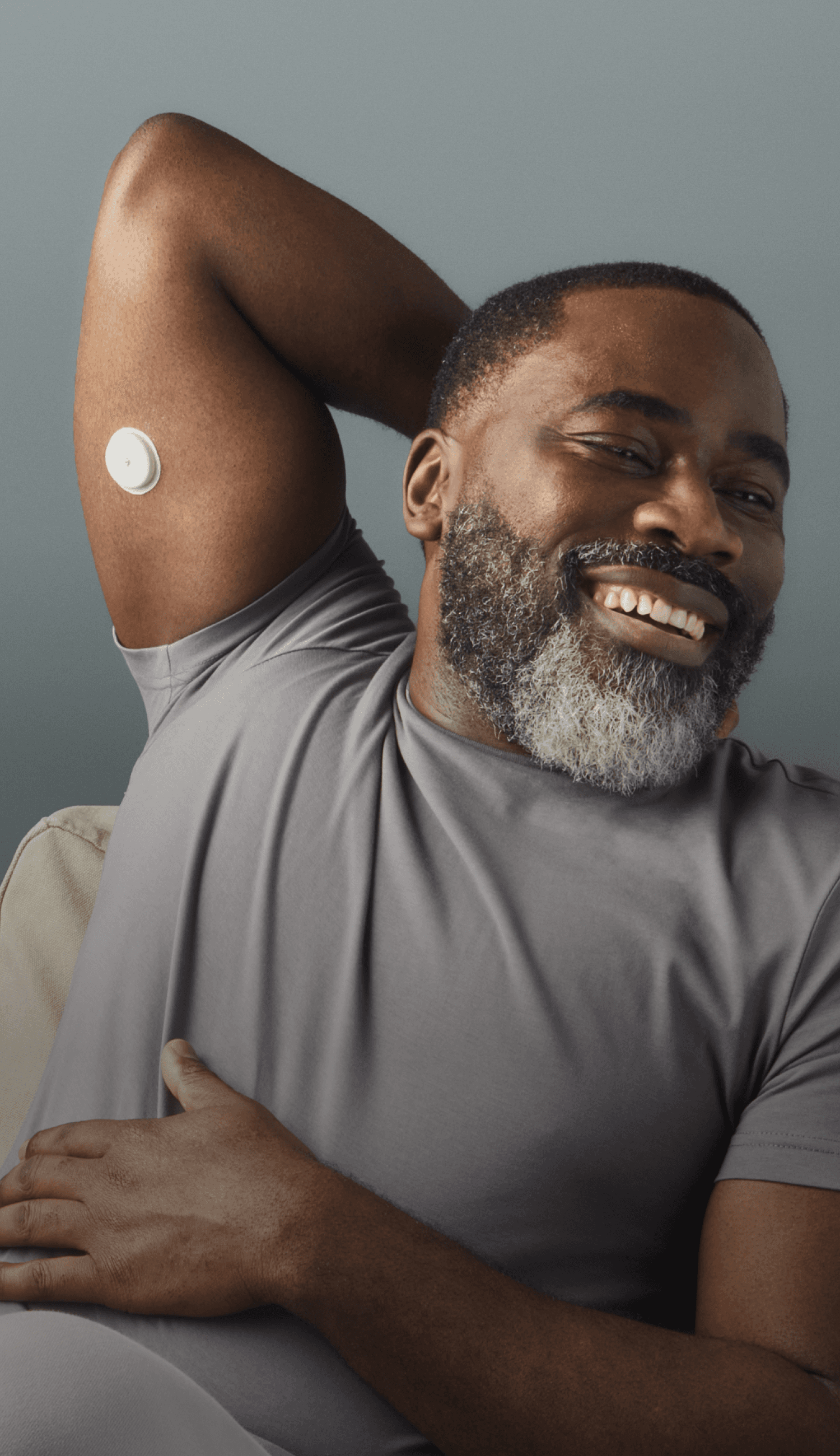 A man looking towards his left side while wearing a Lingo biosensor