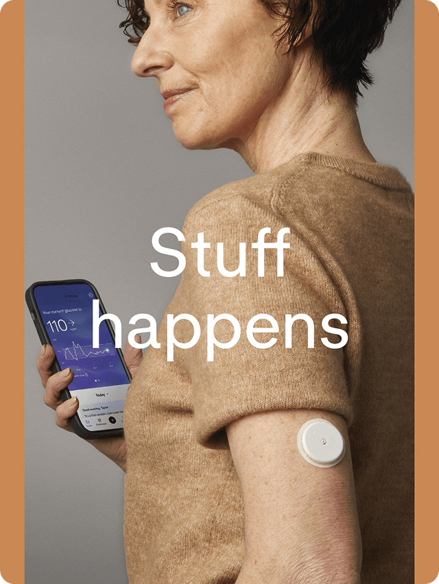 A woman looking at the Lingo app while wearing a Lingo biosensor