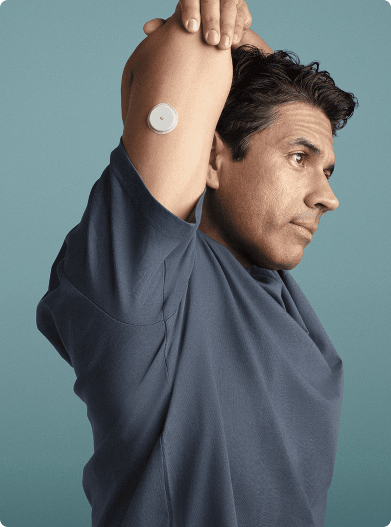 A man stretching wearing a Lingo biosensor