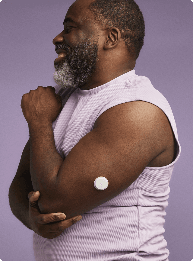A man stretching wearing a Lingo biosensor