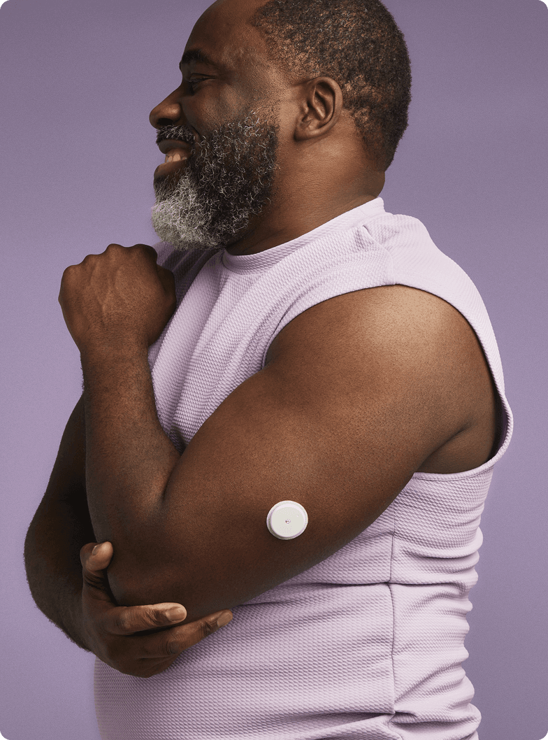 A man stretching wearing a Lingo biosensor