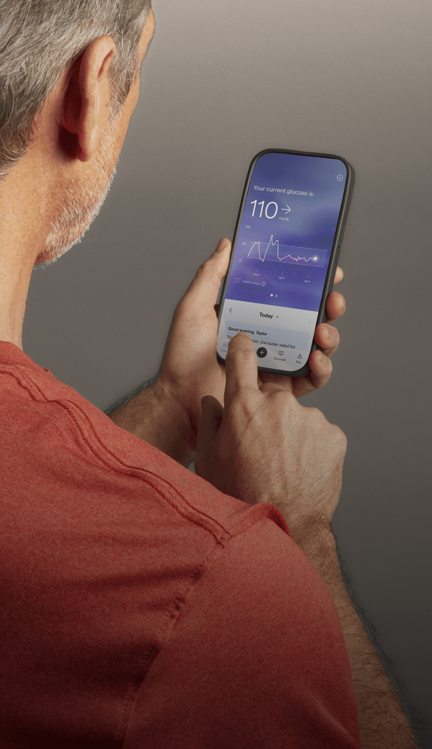 A man looking at the Lingo app on his phone