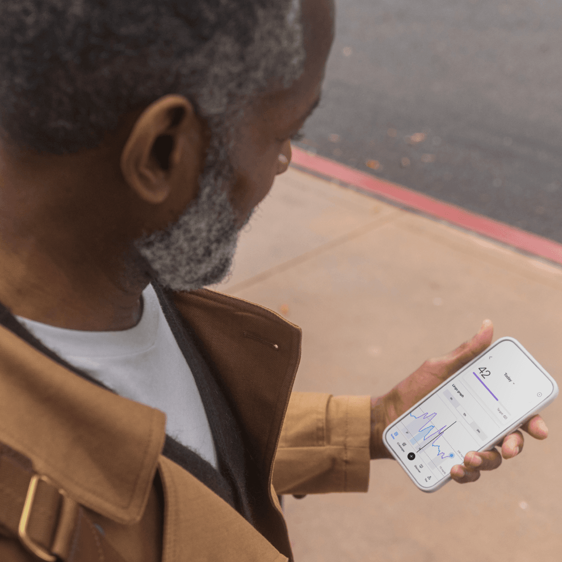 Man looking at Lingo app.