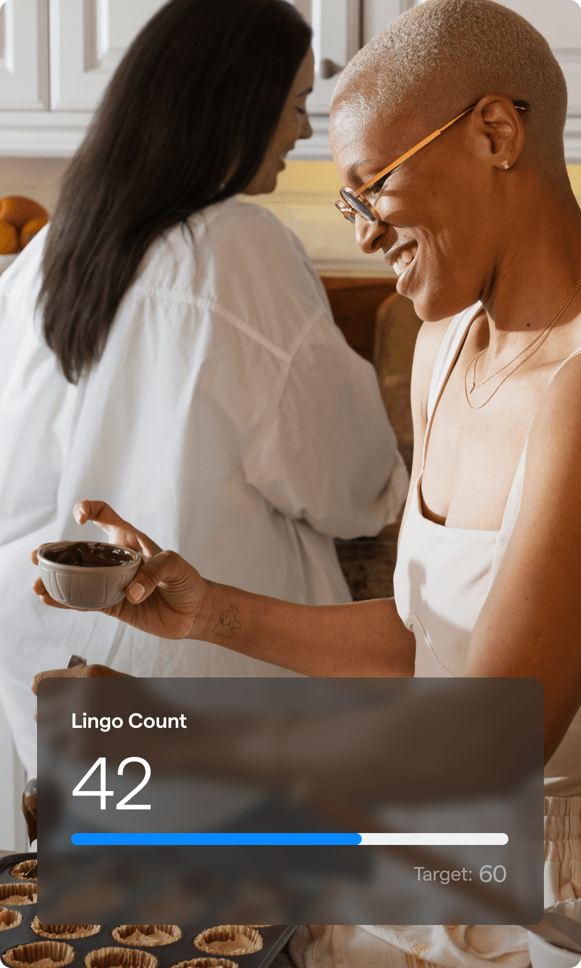 A photo of a woman smiling while pouring olive oil over her salad with a Lingo Count chart overlayed.