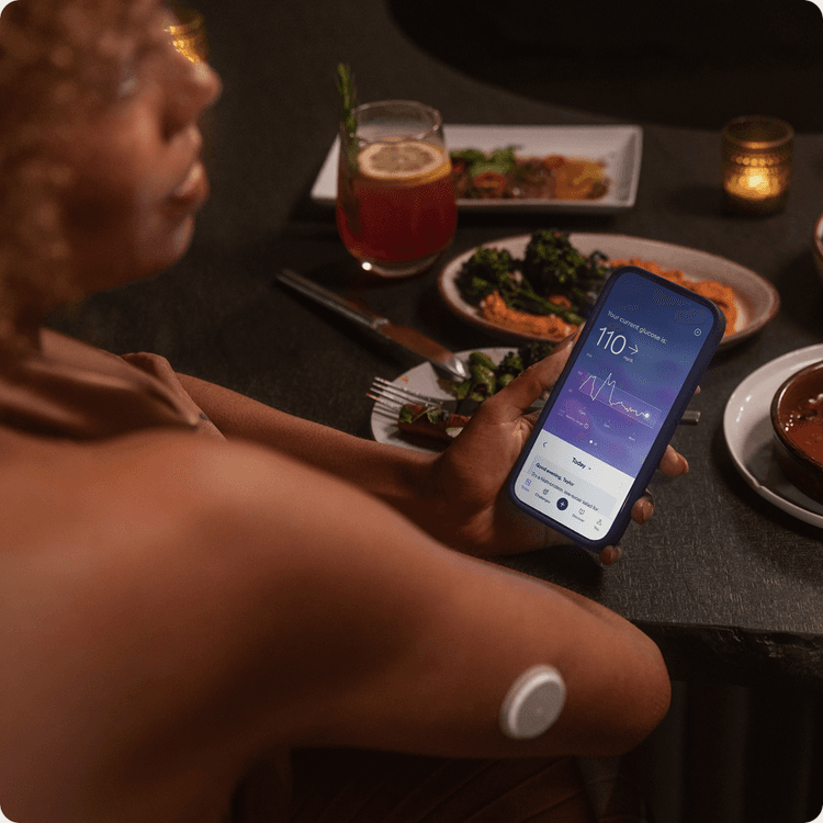 Woman looking at phone with data