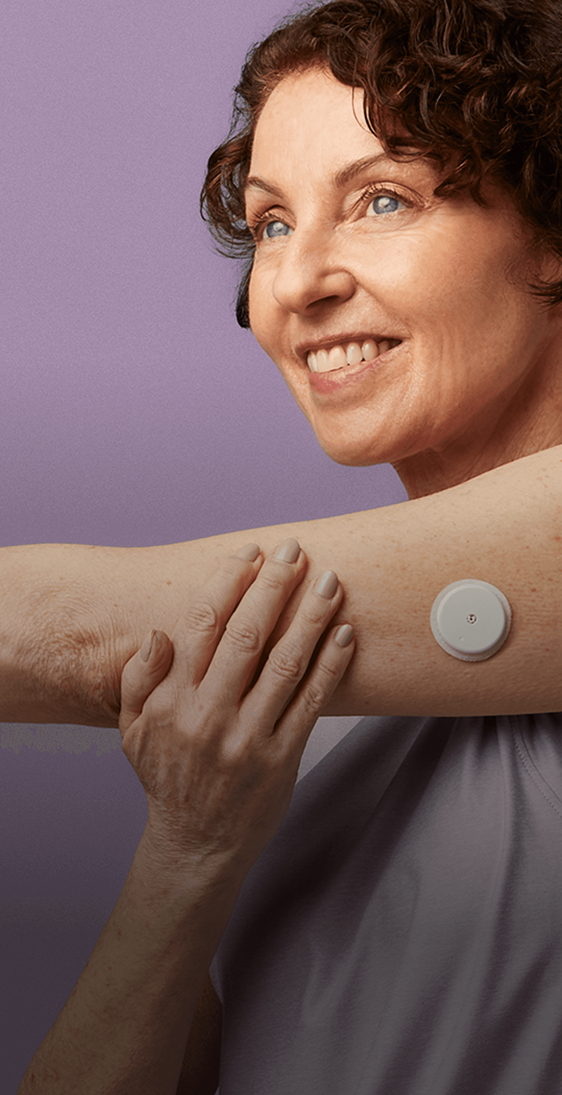 Women stretching her arm out while wearing a Lingo biosensor