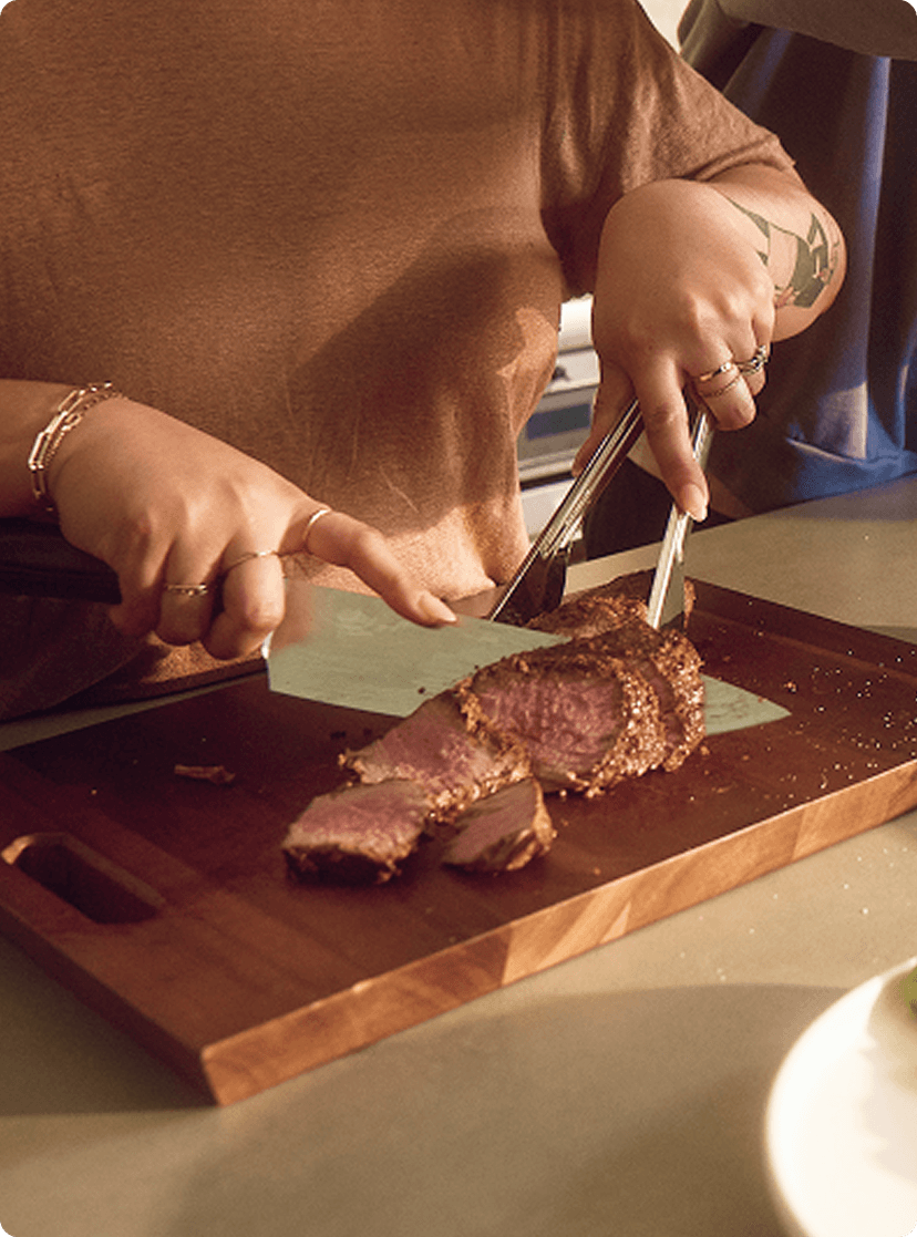 Woman cutting steak