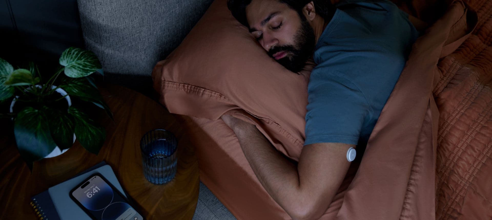Male sleeping wearing a Lingo CGM