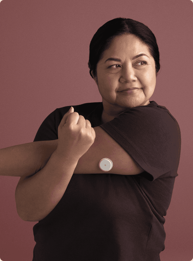 A woman wearing a Lingo Continuous Glucose Monitor