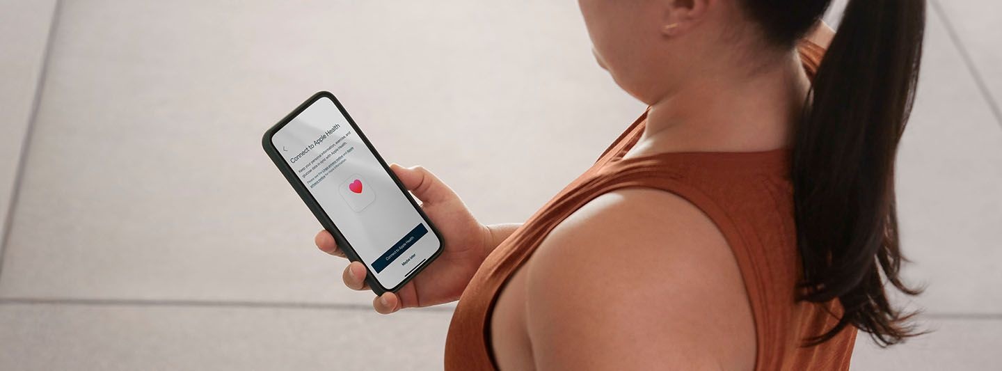 Woman looking at Lingo app on phone