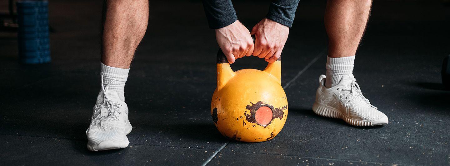 Person lifting a kettlebell