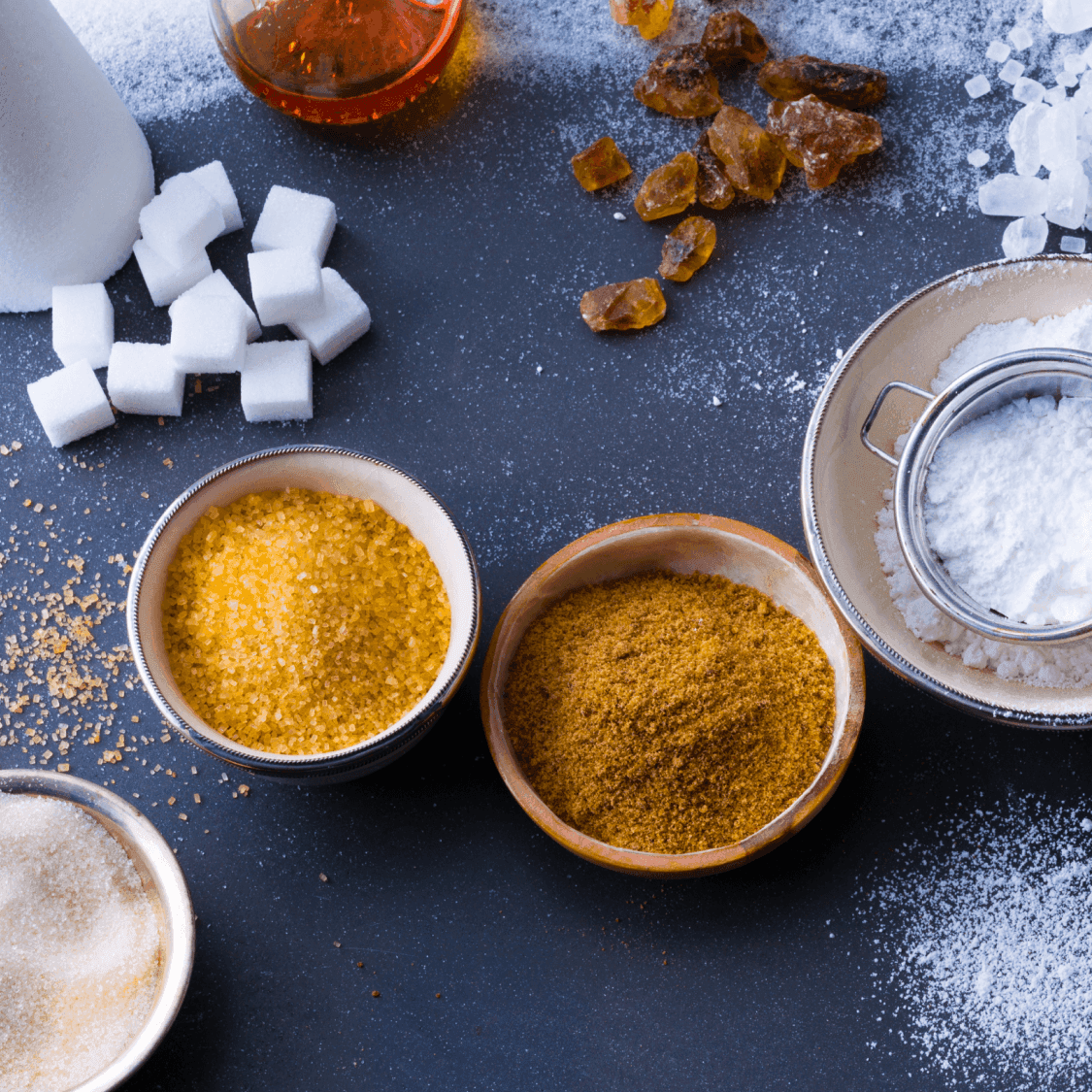 Bowls containing different types of sugar.