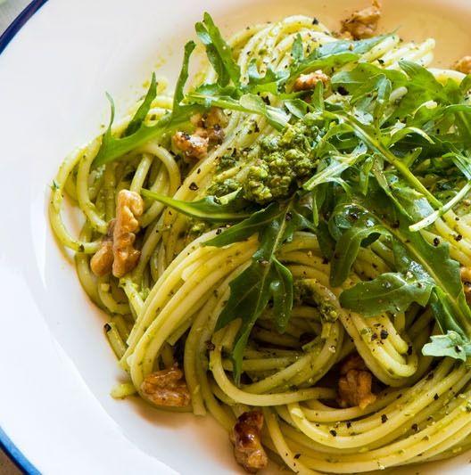 Spaghetti, rocket, pesto, and walnuts