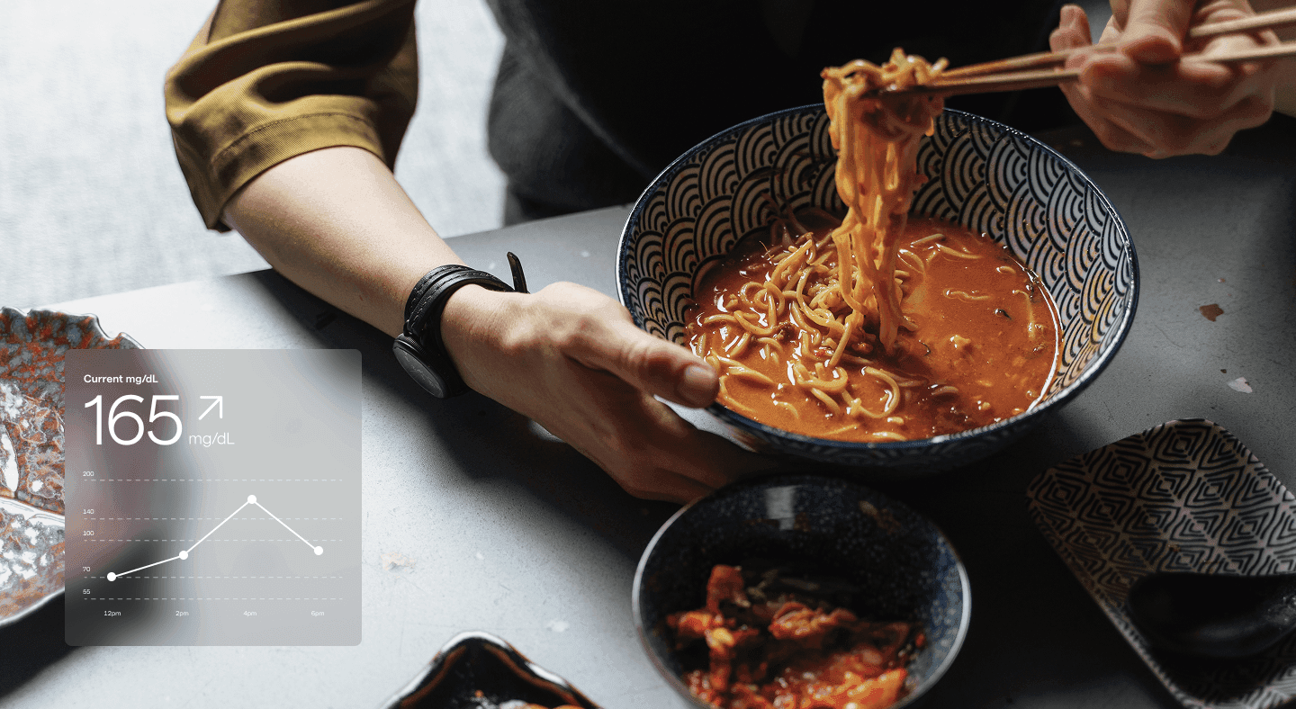 Person eating ramen noodles