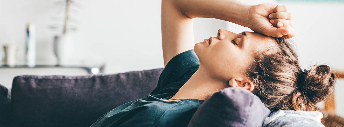 Woman on the sofa looking tired