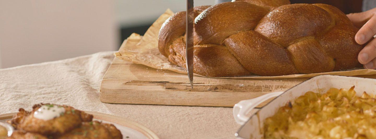Loaf of bread being cut
