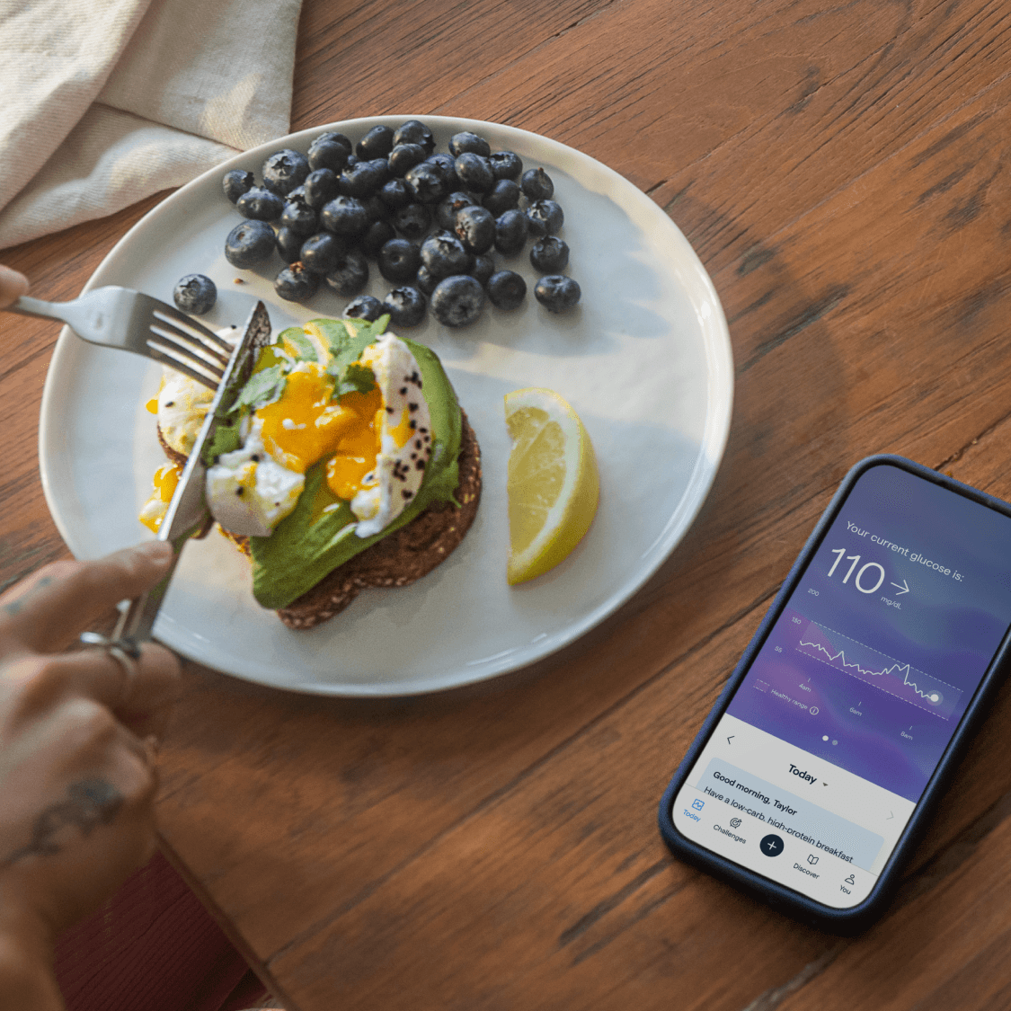 Two breakfasts with phone showing Lingo app.