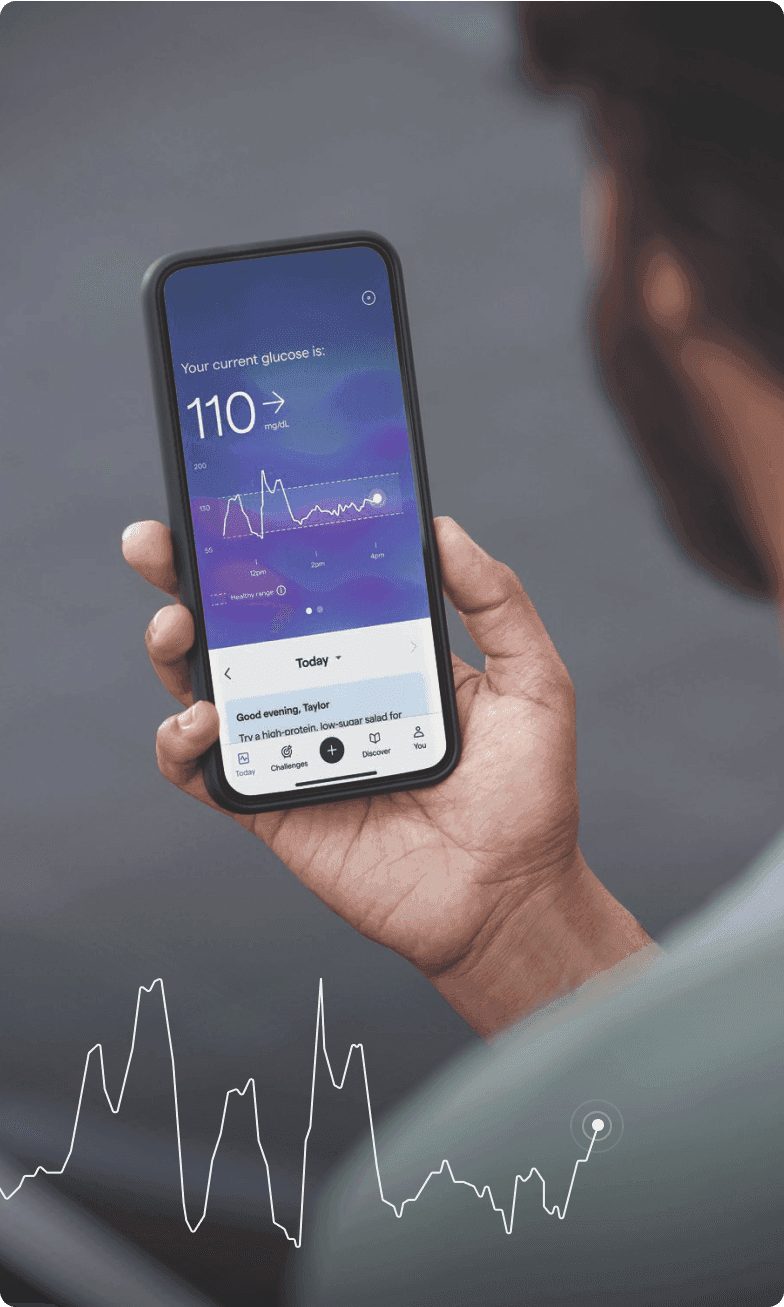 A person looking at their glucose data on their Lingo app