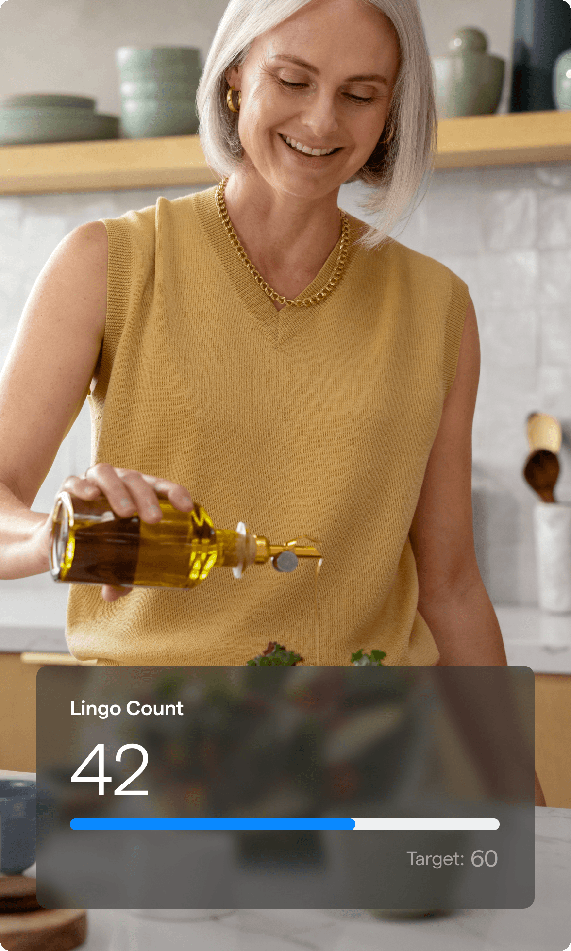 A photo of a woman smiling while pouring olive oil over her salad with a Lingo Count chart overlayed.