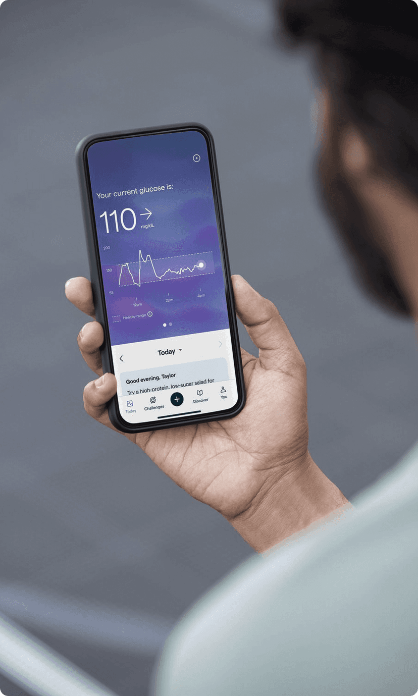 A person looking at their glucose data on their Lingo app
