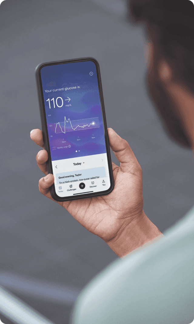 A person looking at their glucose data on their Lingo app