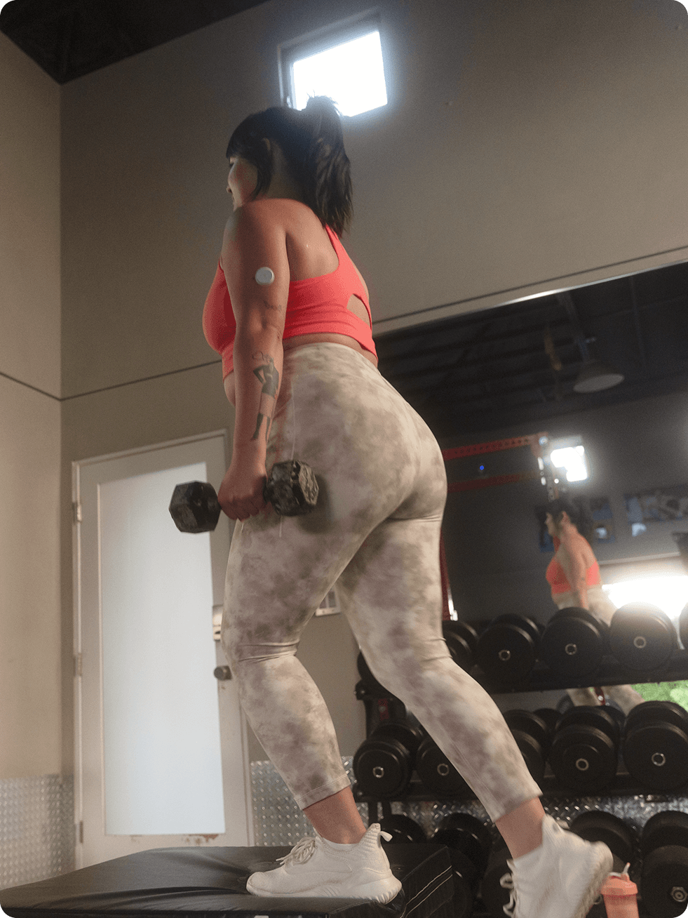 Woman lifting dumbells